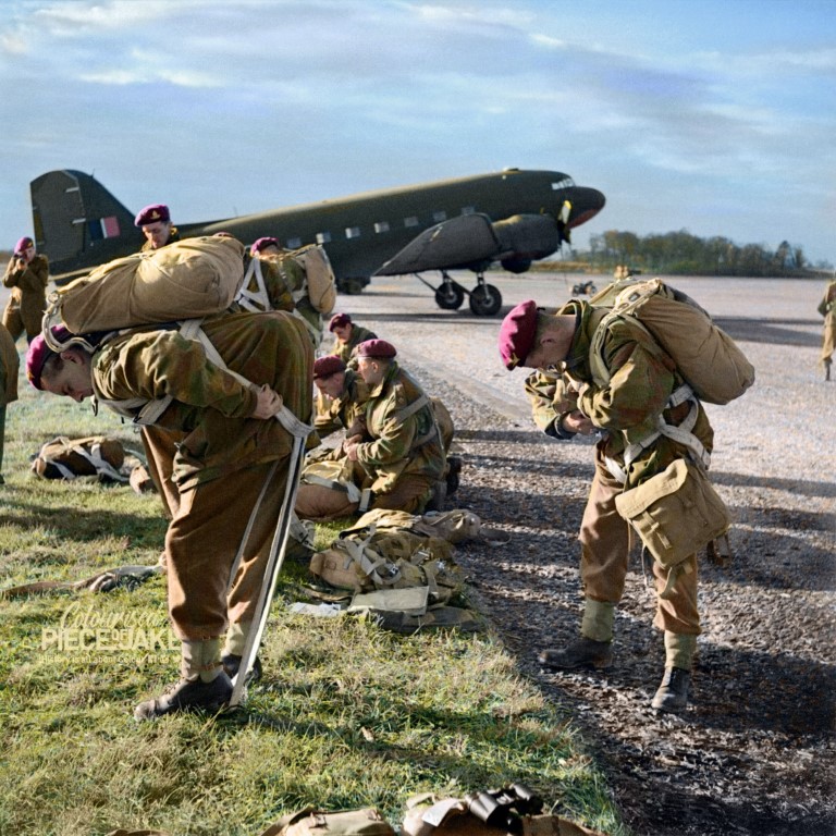 British_paratroops_fitting_their_parachute